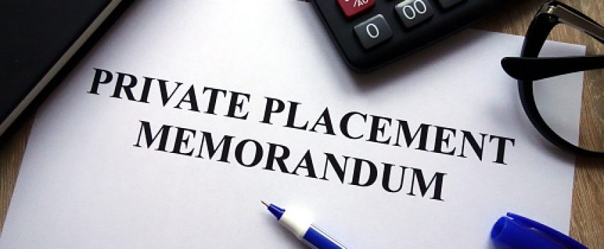 Private placement memorandum document, pen, glasses and calculator on desk